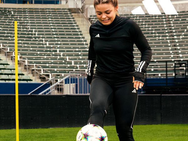 Cropped image of a woman playing soccer.