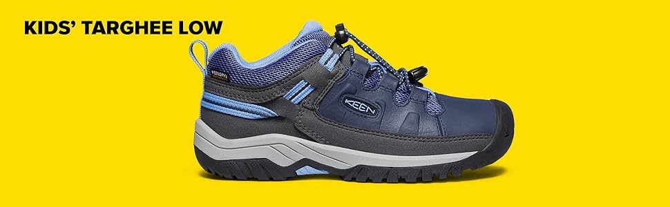 A two-toned blue and grey kid''s targhee sneaker and hiking shoe with a bungee tie on yellow back.