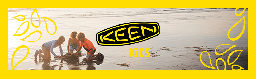 a group of kids playing in the sand at the beach