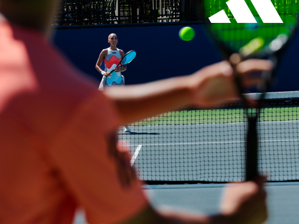 Image of two people playing tennis