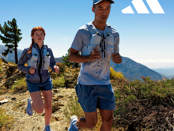 Image of two people running on a trail.