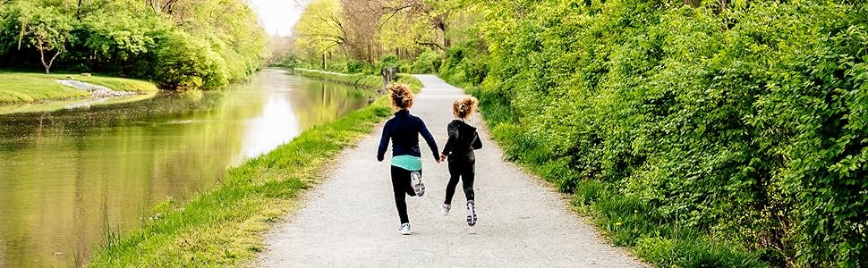 Girls running outside in Saucony sneakers